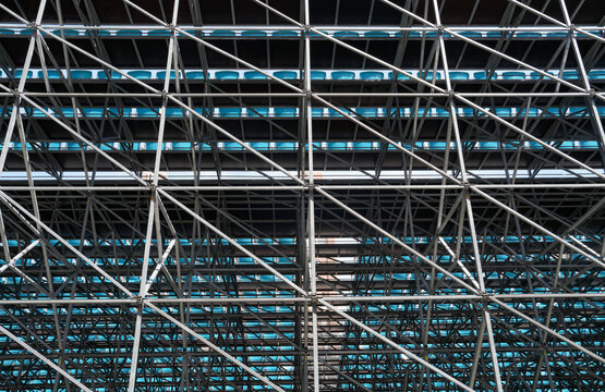 Details with the metallic structure of a large concert stage seen from behind, at a music festival