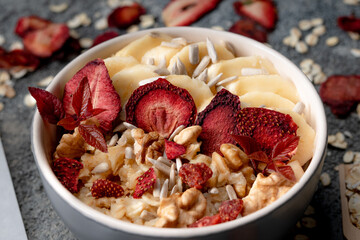 Healthy granola with strawberries banana and wallnut in it.Oatmeal.Healthy lifestyle.Diet