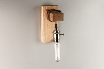 Vintage wall lamp to illuminate the terrace. Antique lamp with Edison bulb. The concept of saving...