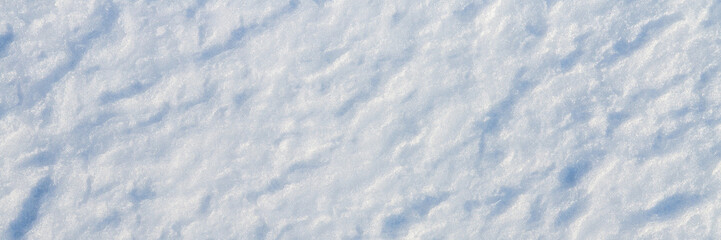Natural snow texture. The surface of the snow crust. Snowy ground. Winter background with snow...