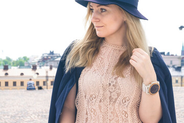 portrait of a blond woman waiting for her friends in helsinki finland