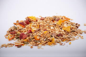 Healty breakfast.Healthy granola.Healthy lifestyle.Healthy fruits.Kitchen in background.White background