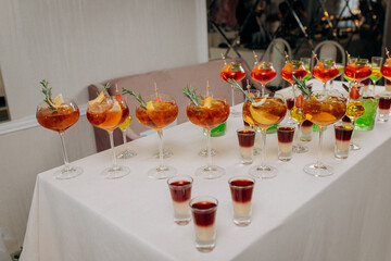 Welcome drink with cocktail glasses and drinks at an event. Alcoholic beverages at a wedding