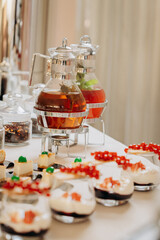 Dessert buffet with delicious sweet bakery and coffee-snack with stylish banks of lemonade and tea