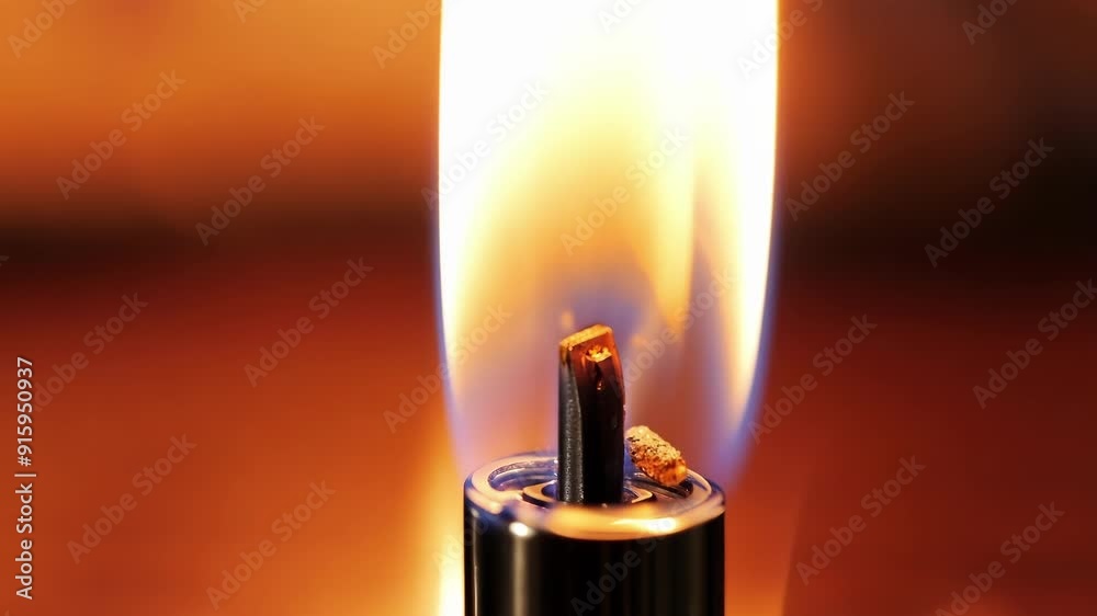 Poster a closeup shot of a lighter being sparked revealing a steady flame that grows in intensity.