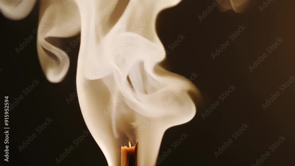 Poster extreme closeup of a burning incense stick capturing the intricate details of the smoke as it twists