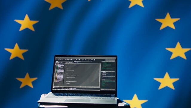 European Union intelligence agency using laptop to protect against mass propaganda tools affecting elections. EU security service engaging in psychological operations using device, camera B - Powered by Adobe