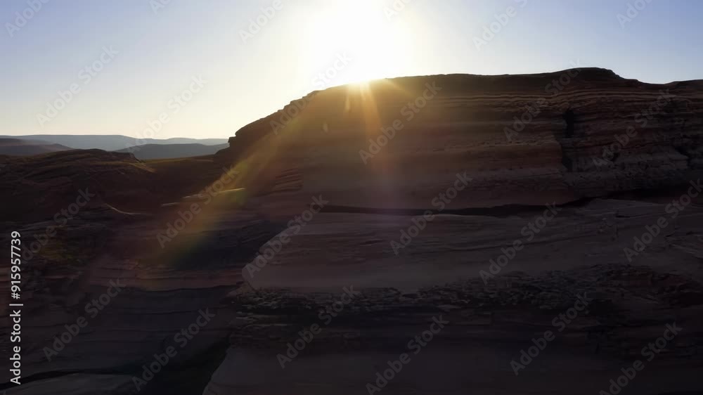 Fototapete the camera captures the changing light and shadows as the sun moves across the weathered rocks accen