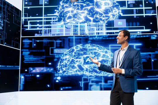 Cheerful presenter speaking at tech conference, exploring latest AI technology trends and case studies. Upbeat IT professional presenting how artificial intelligence is shaping future during event