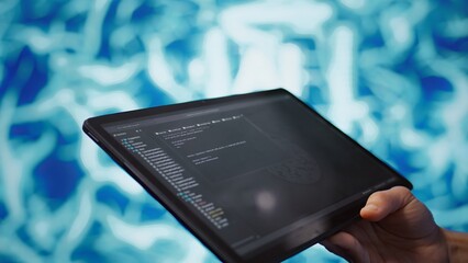 Software developer with tablet programming artificial intelligence computing simulating human...