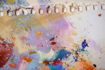 Colorful abstract texture. Smears of oil paint on an art palette. The concept of the modern school of art. Fragment of creative work. Colors of the year 2025.