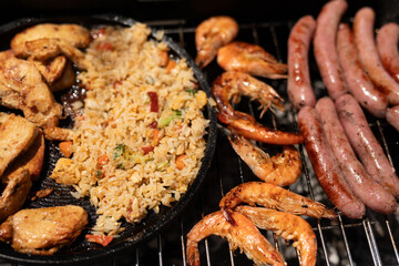 The ultimate BBQ spread chicken fried rice shrimp and sausages What more could you ask for