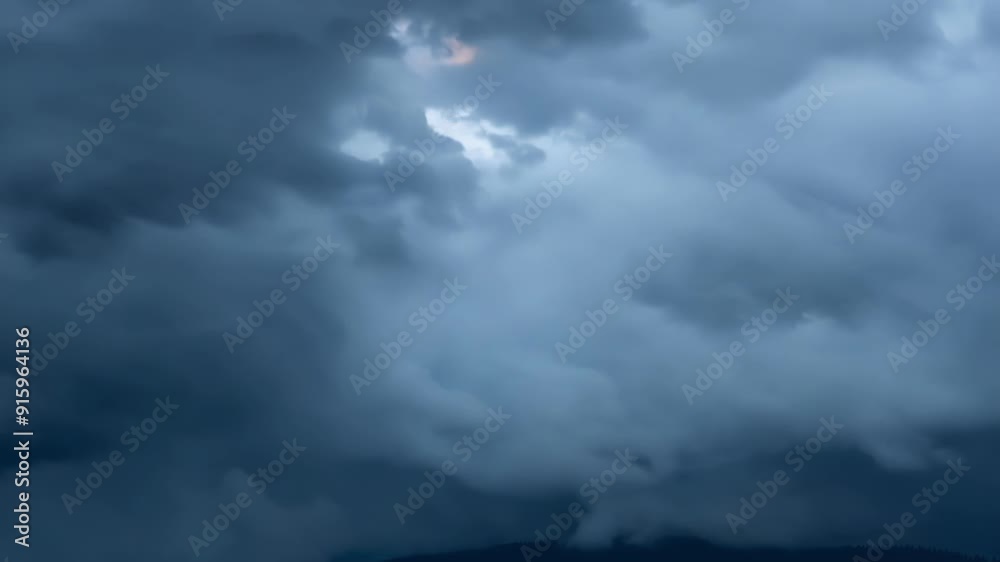 Poster a closeup shot of dark grey storm clouds rolling and cascading over one another.
