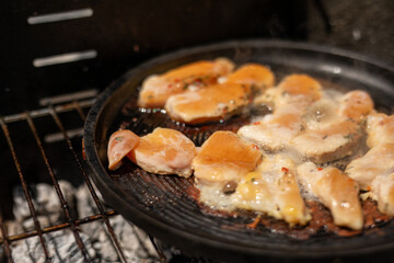 Chicken sizzling on the grill ready for a delicious meal