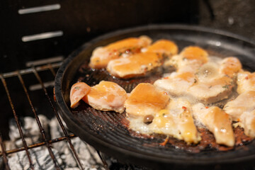Chicken breasts sizzling on the grill getting ready for a delicious meal