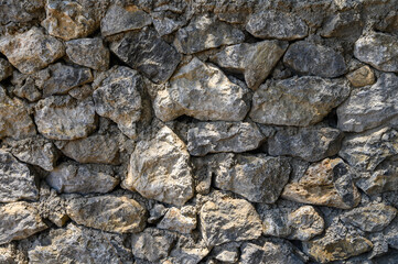 Texture of old stone brick wall in city
