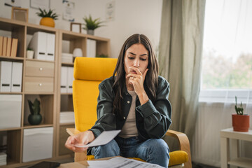 Worried adult woman think and calculate how to pay domestic finances