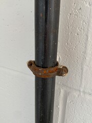 Metal pipe mounted to a wall