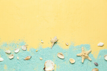 Blue sea salt with seashells and starfishes on yellow background