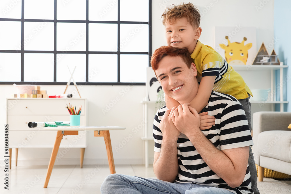 Sticker little boy hugging his father at home