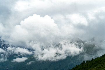 climbing Romsdalseggen trail in Andalsnes Norway in summer with rocky mountains in the background