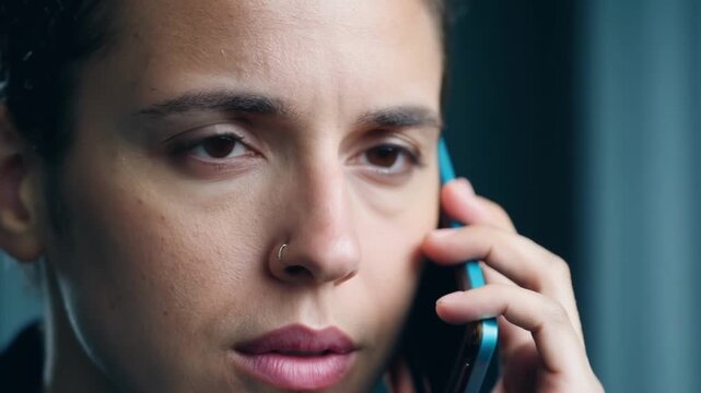 A closeup of an event coordinators determined expression as they make lastminute phone calls to vendors.