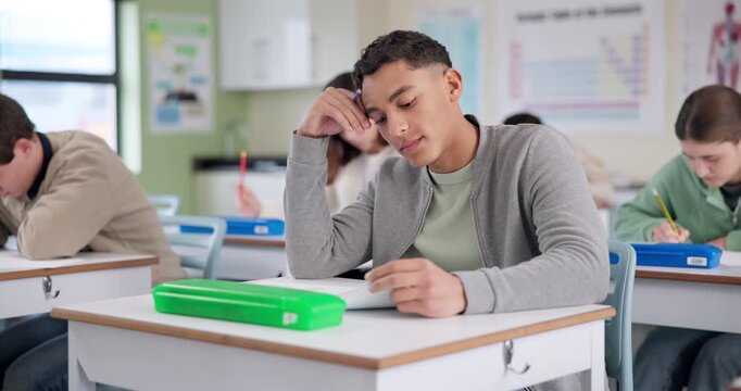 Boy, stress and writing test in classroom with thinking, remember and confused by question in paper. Student, teenager and high school kids with anxiety, mistake or brain fog in assessment at academy