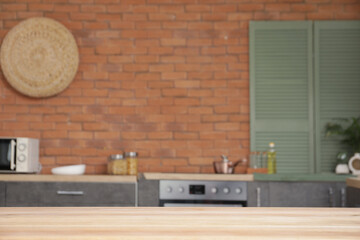 Wooden dining table in modern kitchen, closeup