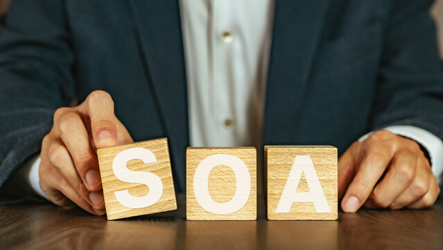 There is wood cube with the word SOA. It is an abbreviation for Service Oriented Architecture as eye-catching image.
