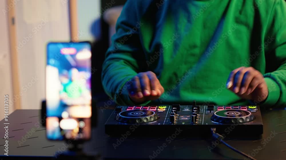 Aufkleber Skilled audio engineer teaching online mixing tunes lessons by using smartphone on tripod to record himself in home studio. Producer hosting a master class with soundboard console gear. Camera A.