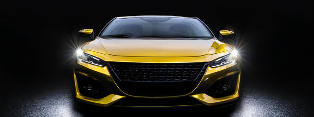 luxury yellow car on dark background