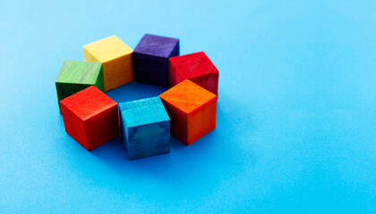 Colorful wooden cubes grouped together in a circle