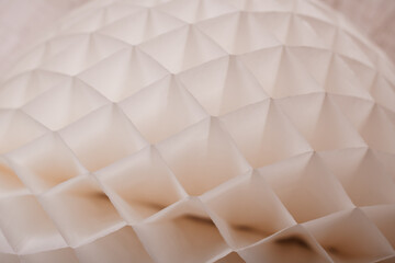 Fototapeta premium A detailed close-up of a white paper honeycomb decoration