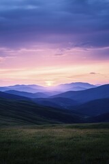 Fototapeta premium A serene sunset panorama over undulating hills evokes feelings of tranquility and a deep bond with the splendor of the natural world.