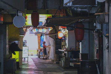 Pedestrian zone with cerarmic shops, restaurants, and historic architecture in downtown Naha...