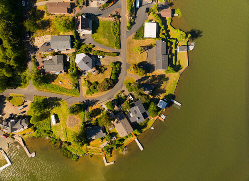 A residential area with houses and a lake