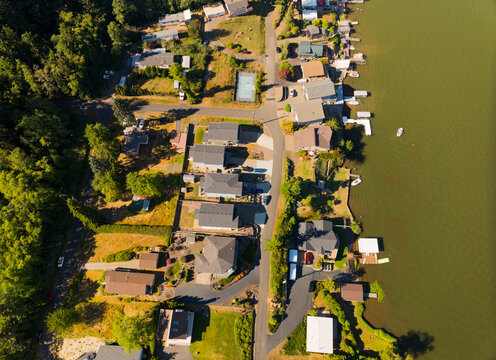 A residential area with houses and a lake