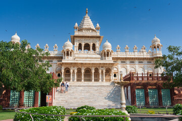 Obraz premium Beautiful view of Jaswant Thada cenotaph, Jodhpur, Rajasthan, India. Built out of intricately carved sheets of Makrana marble, they emit a warm glow when illuminated by the Sun. Blue sky background.