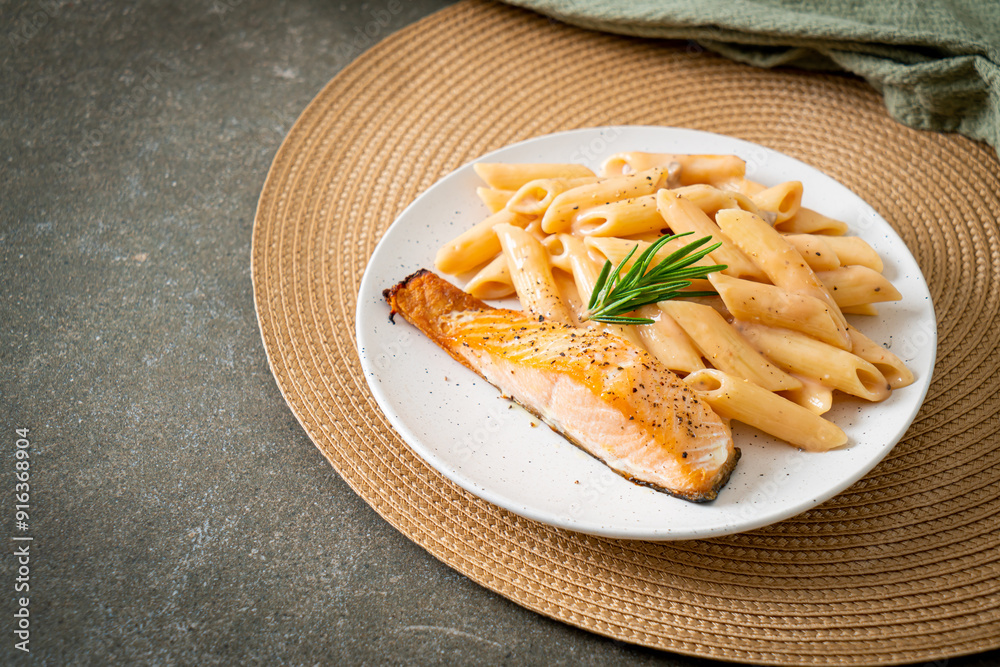 Sticker salmon with penne pasta cream sauce