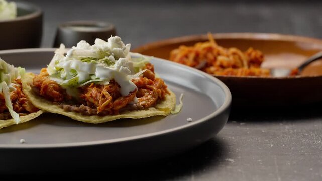 Mexican tostadas of chicken tinga, travel shot left
