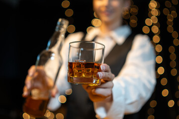 Barwoman pouring whiskey whiskey glass..