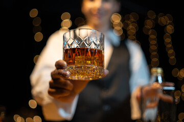 Barman pouring whiskey whiskey glass beautiful night