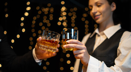 Barwoman pouring whiskey whiskey glass..