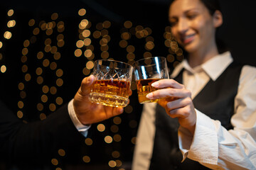 Barwoman pouring whiskey whiskey glass..