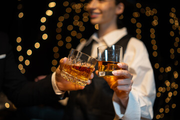Barwoman pouring whiskey whiskey glass..