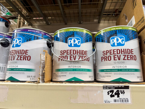 Gallon containers of PPG Speedhide Pro EV Zero base paints on store shelf.