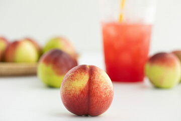 Fresh Organic Heavenly Peaches on white background.