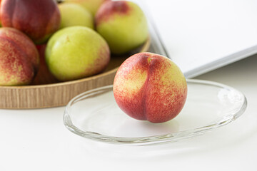 Fresh Organic Heavenly Peaches on white background.