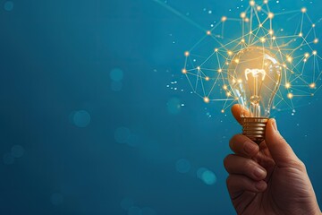 Illuminating Ideas: A Hand Holding a Glowing Light Bulb