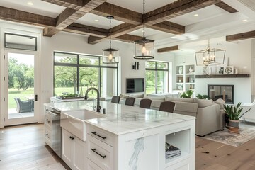 Beautiful modern farmhouse open concept kitchen with large center island, white cabinets and wood beams in the ceiling. Marble countertops, stainless steel appliances. Luxury home interior